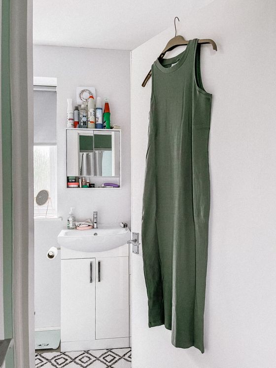 Green ribbed maxi dress on a hanger